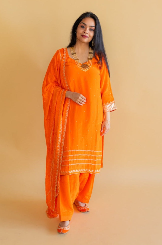 Electric Orange Pure Crepe Salwar Kameez styled on a model for visual reference